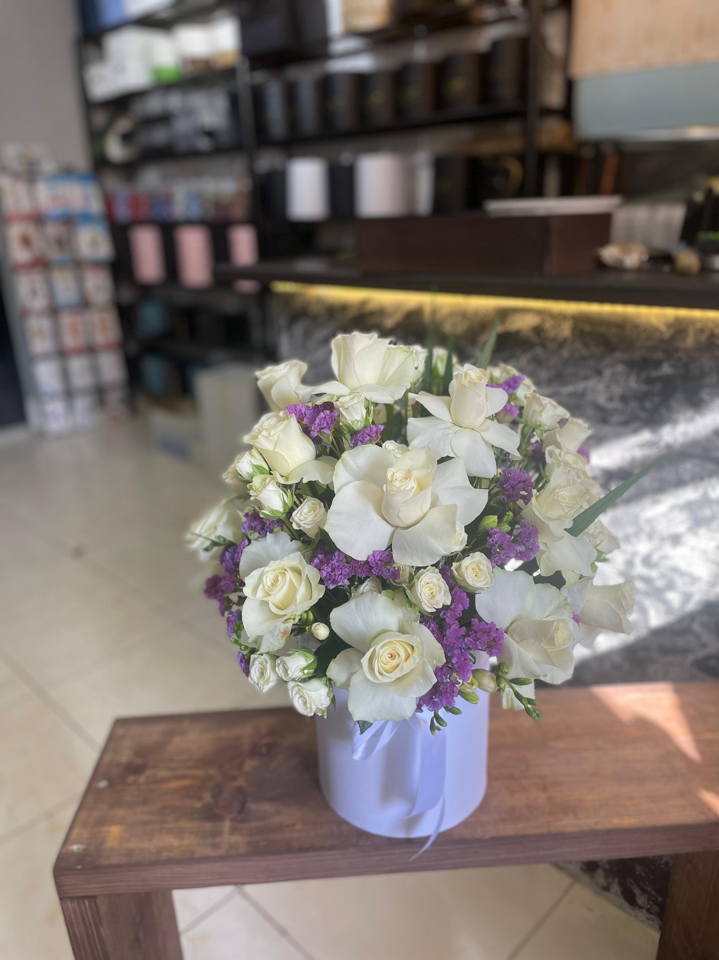Mixed white roses and purple flowers ..