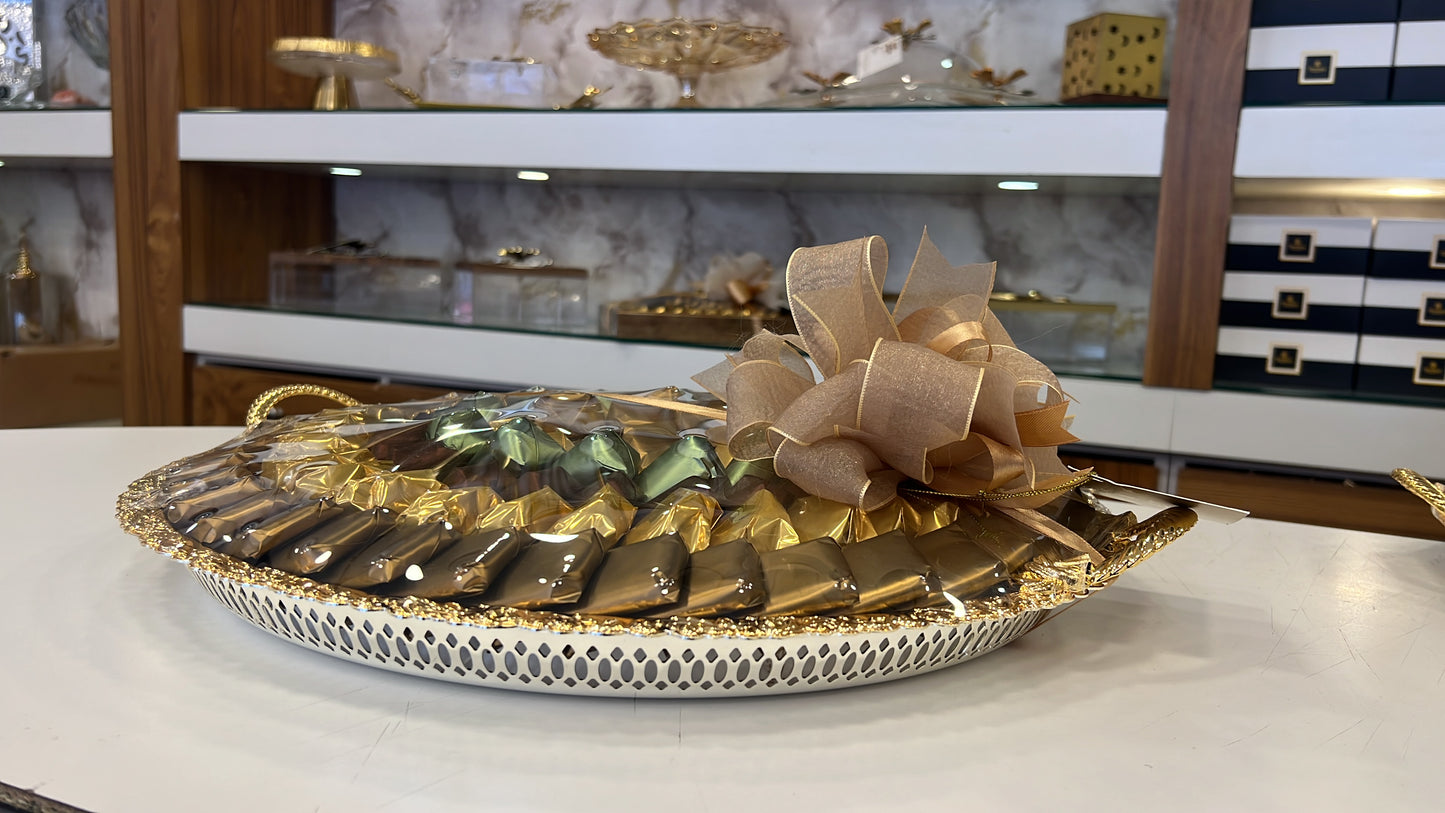 2.85 kg of mixed chocolate in an elegant “Al-Saif” gold tray