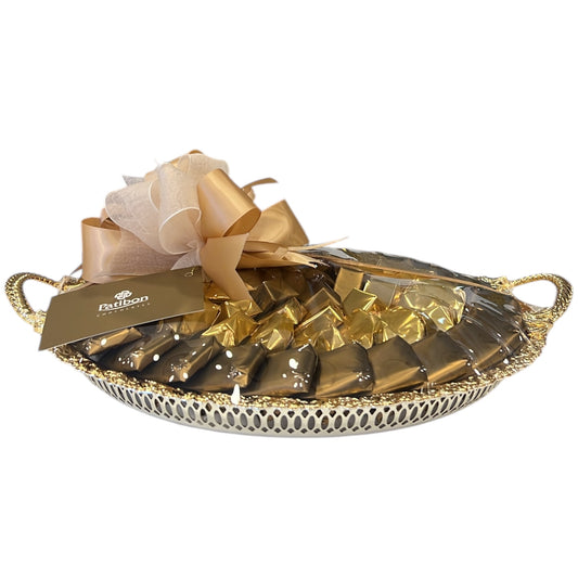 2.85 kg of mixed chocolate in an elegant “Al-Saif” gold tray